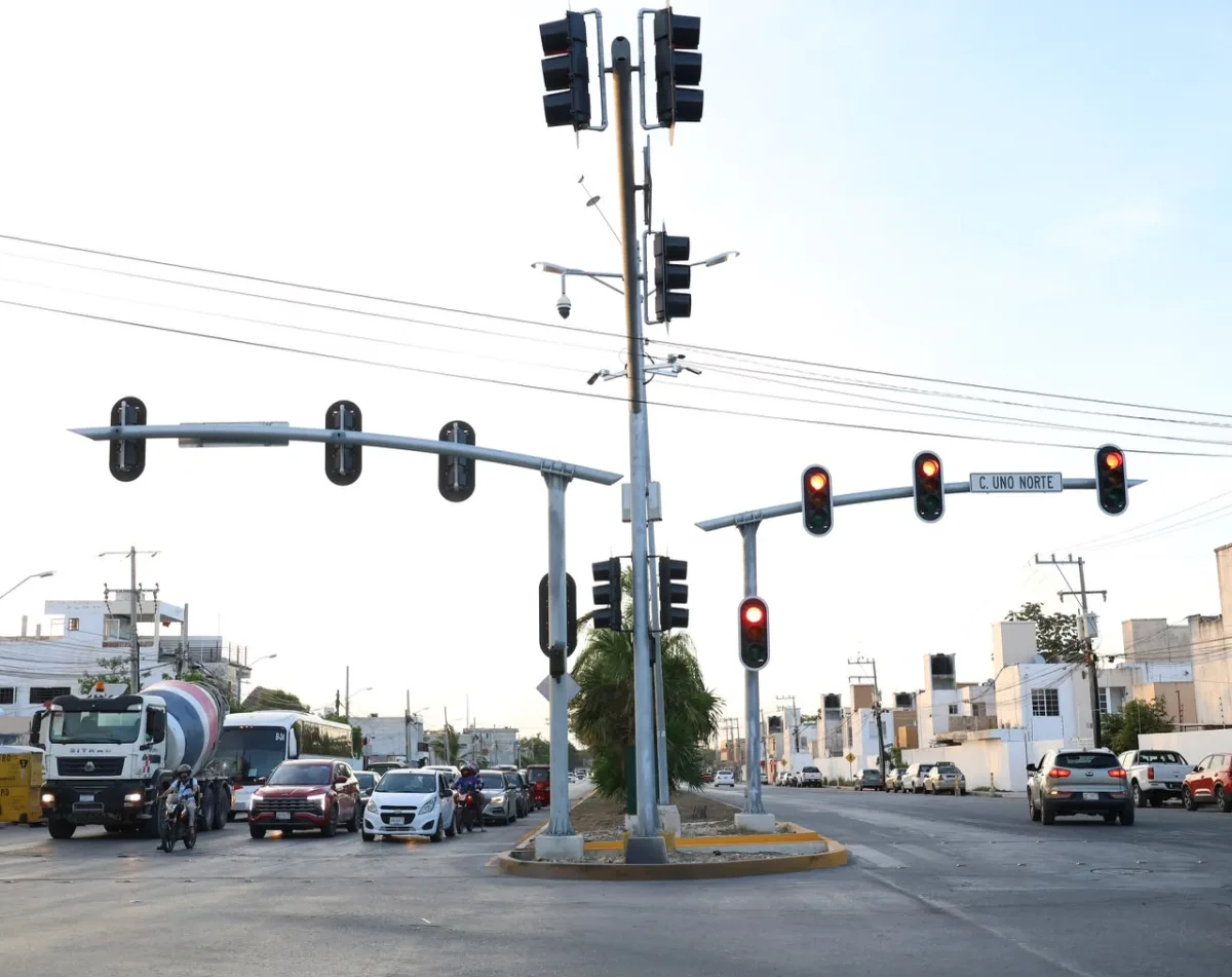 Renovated pedestrian crossing with bollards and signage on Kabah Avenue in Cancun