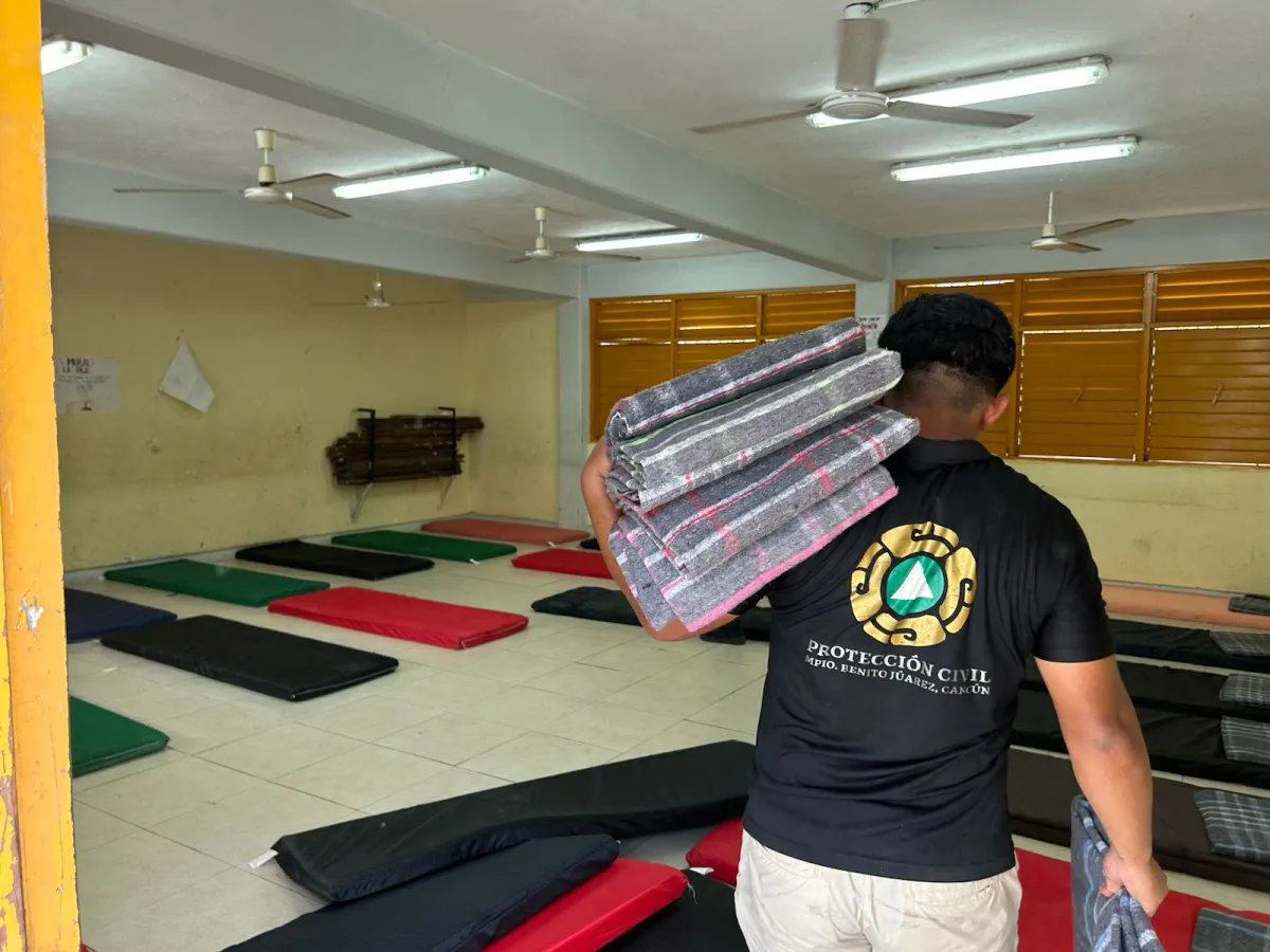 Civil Protection staff inspect a temporary shelter in Cancún